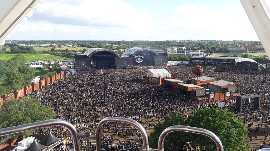 Hellfest Festival from high up with two huge stages at back and vast crowds in front