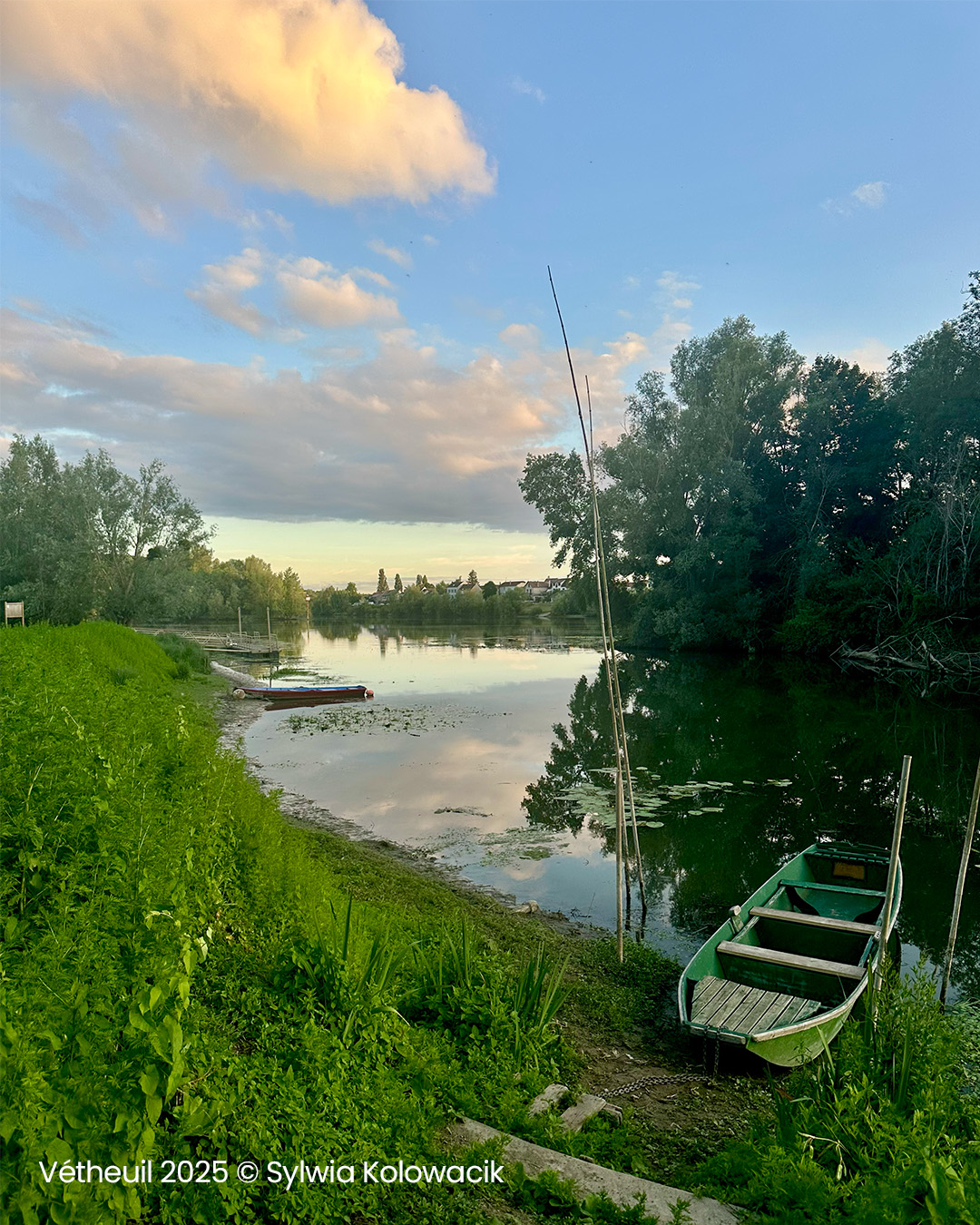 Vetheuil nexr Giverny with river snaking along beside banks and small boat