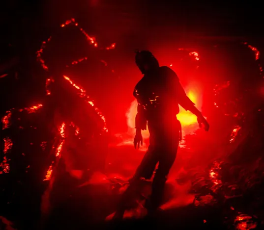 Halloween at Parc Asterix with figure collapsing against red flames Pompeii