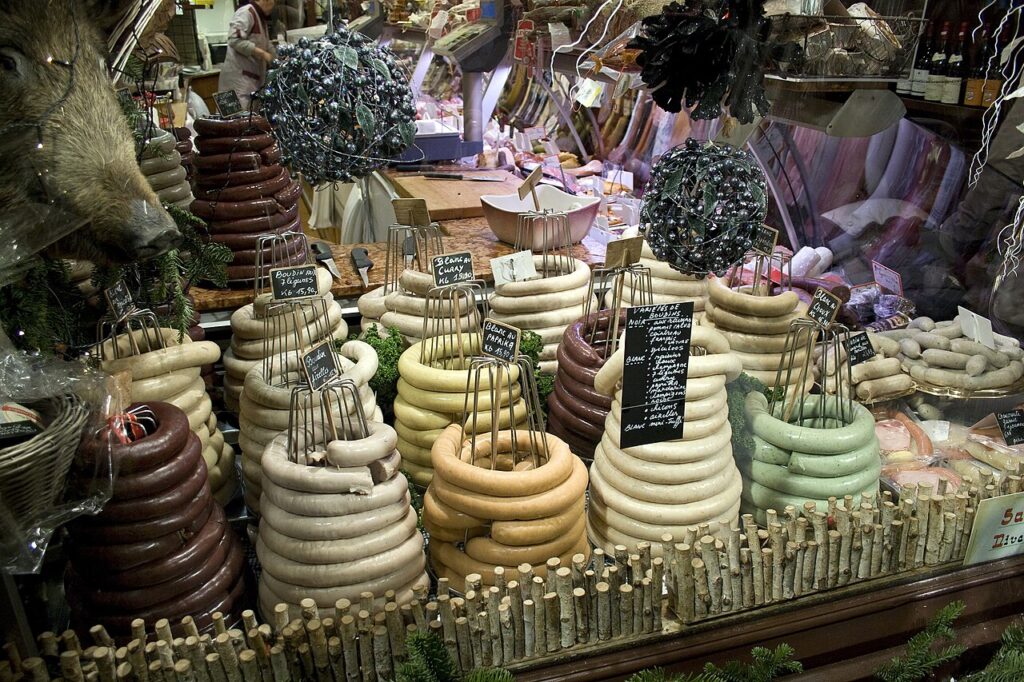 Piles of boudin noir and blanc at a market stall