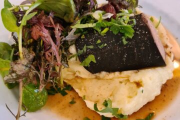 Andouille at Puteaux restaurant showing andouille on top of mashed potato