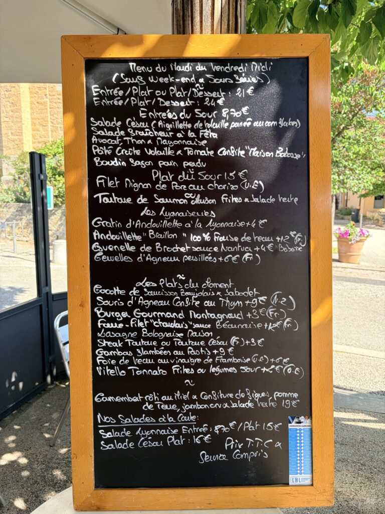 Big blackboard outside L'Auberge du Village bouchon in Dardilly with all ingredients