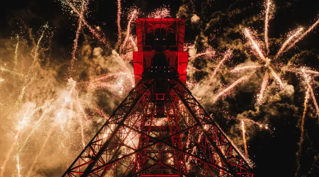Sainte barbe festival in lens with huge steel structure lit up with fireworks