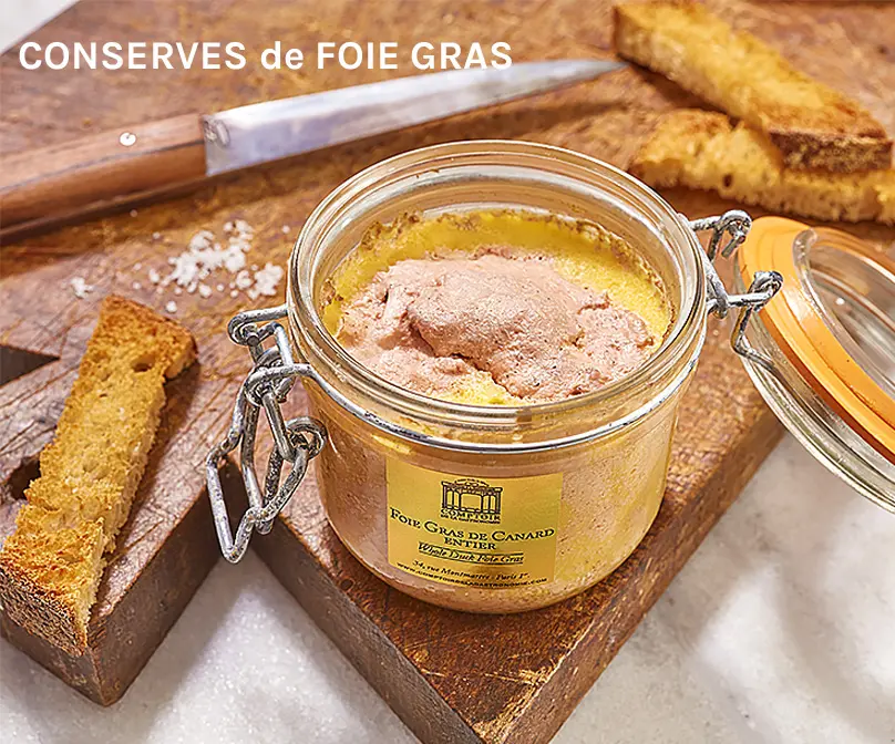 Le Comptoire de la Gastronomie Foie Gras jars open showing foie gras and fat around