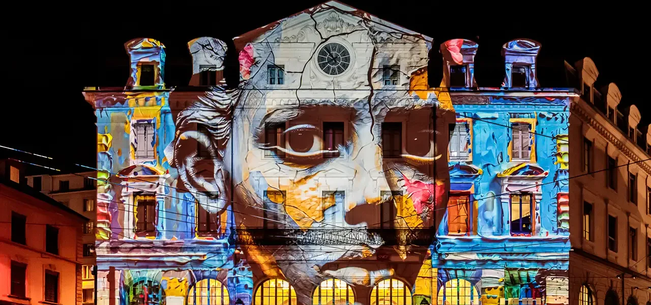 Fête des Lumières Lyon with strange face projected onto Saint Paul Station