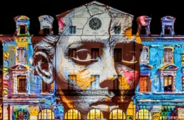 Fête des Lumières Lyon with strange face projected onto Saint Paul Station