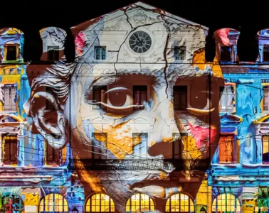 Fête des Lumières Lyon with strange face projected onto Saint Paul Station