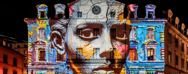 Fête des Lumières Lyon with strange face projected onto Saint Paul Station