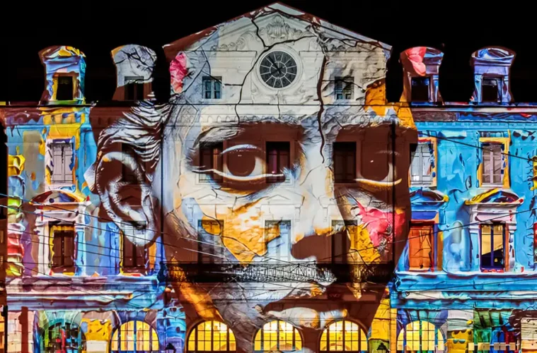 Fête des Lumières Lyon with strange face projected onto Saint Paul Station