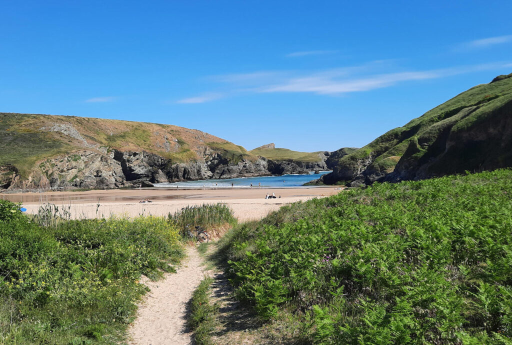 Beach at Herlin Brittany showing path leading from sand dunes down to sea