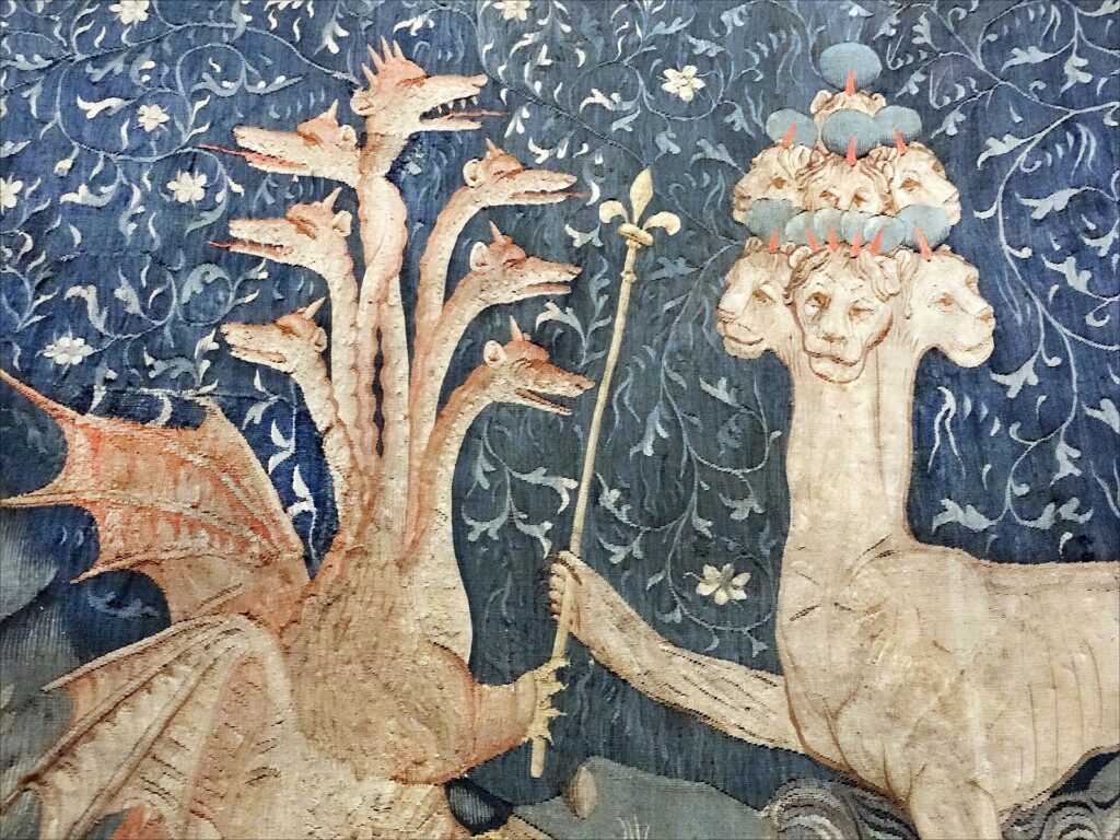Apocalypse Tapestry showing beat handing over a sceptre with the fleur de lys to the monster, symbolising France handing power to england