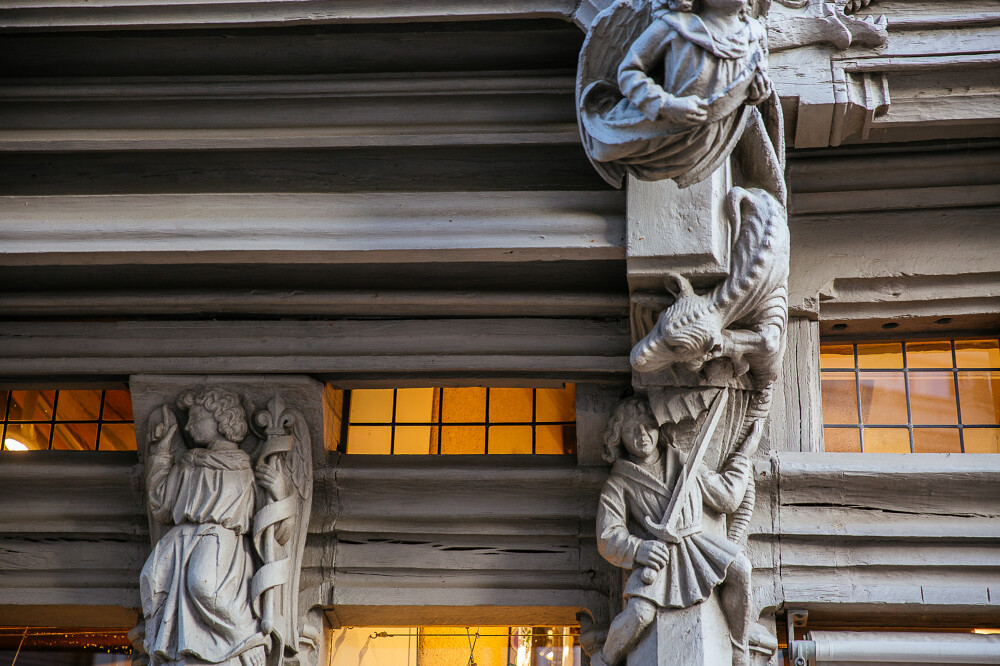 Maison d'Adam angers close up of medieval caarved wooden characters on old house