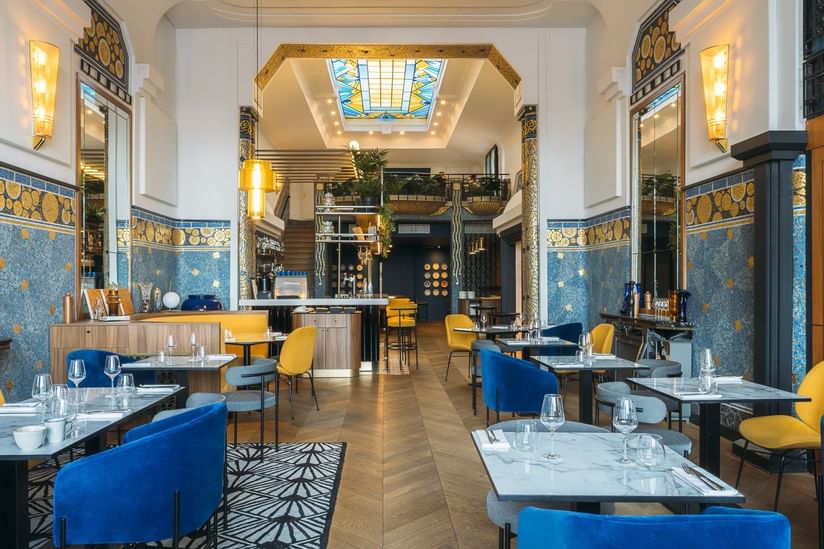 Oceania Hotel d'Anjou Bar with gold and blue Art Deco decoration